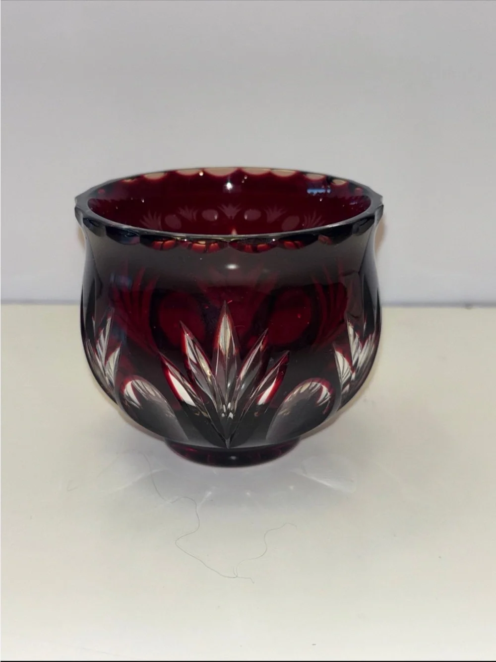 Bohemian Red Crystal glass votive candle holder features intricate cut-to-clear